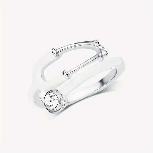 A stylish, transparent hand ring shaped like a stethoscope, designed for medical professionals and healthcare enthusiasts.