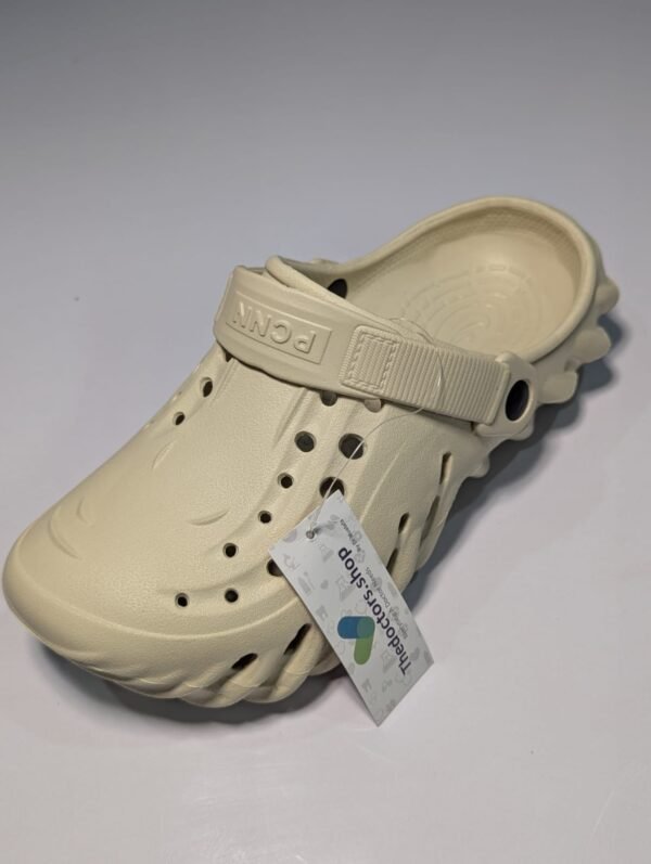 Pair of beige PGM medical clogs with ventilation holes and adjustable heel strap, displayed with TheDoctors.shop tag