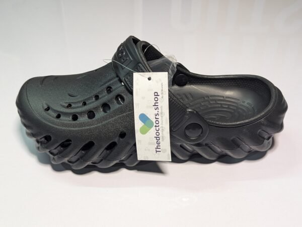 Pair of beige PGM medical clogs with ventilation holes and adjustable heel strap, displayed with TheDoctors.shop tag