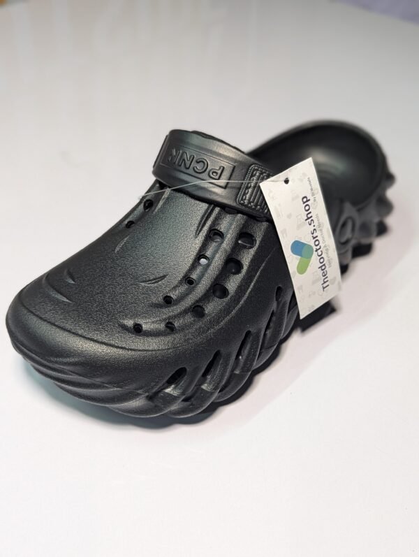 Pair of beige PGM medical clogs with ventilation holes and adjustable heel strap, displayed with TheDoctors.shop tag