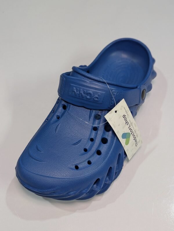 Pair of beige PGM medical clogs with ventilation holes and adjustable heel strap, displayed with TheDoctors.shop tag