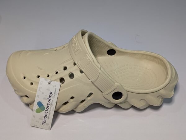 Pair of beige PGM medical clogs with ventilation holes and adjustable heel strap, displayed with TheDoctors.shop tag
