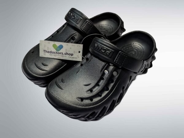 Pair of beige PGM medical clogs with ventilation holes and adjustable heel strap, displayed with TheDoctors.shop tag