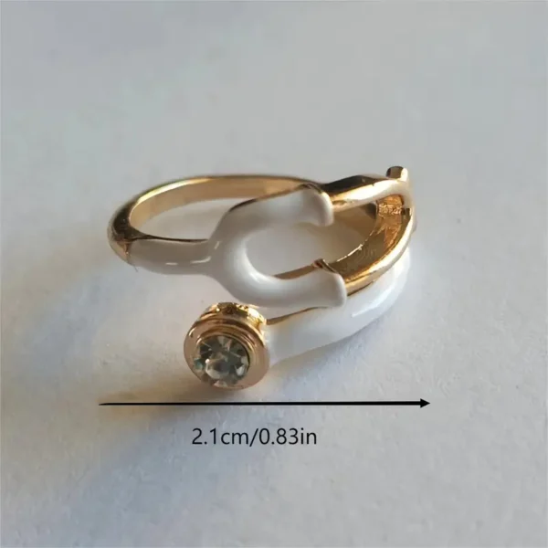 A stylish, transparent hand ring shaped like a stethoscope, designed for medical professionals and healthcare enthusiasts.