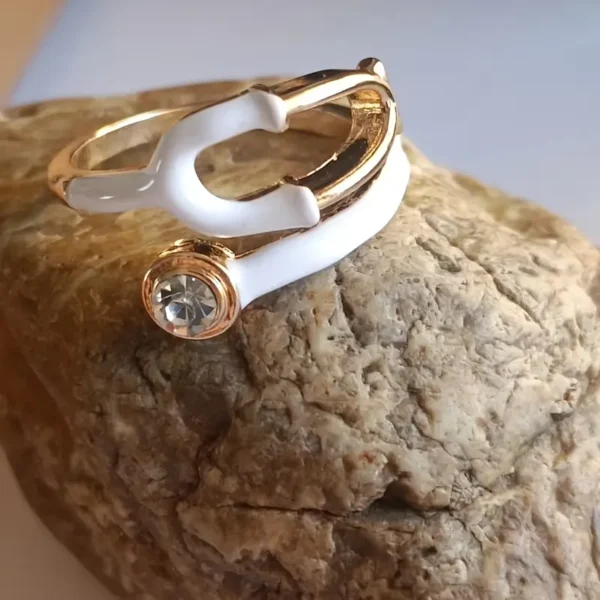 A stylish, transparent hand ring shaped like a stethoscope, designed for medical professionals and healthcare enthusiasts.